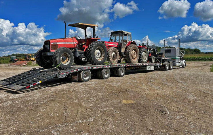 transport truck hauling farm equipment