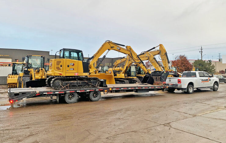 Flatbed Hot Shot Truck hauling an Excavator Transport to Guelph